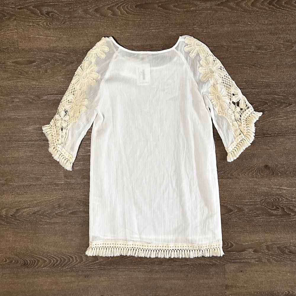 Umgee
Mini dress with floral crochet sleeves and fringe detail size S Small NWT - Picture 8 of 13